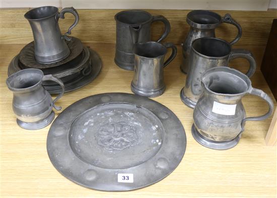 A collection of 18th and 19th century pewter mugs, a dish, etc.